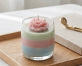 Rosé Pastel Bloom candle with sculpted pink rose on wooden tray